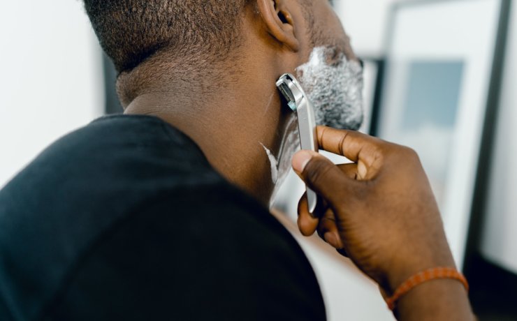 man shaving himself