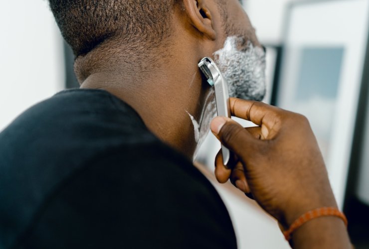 man shaving himself