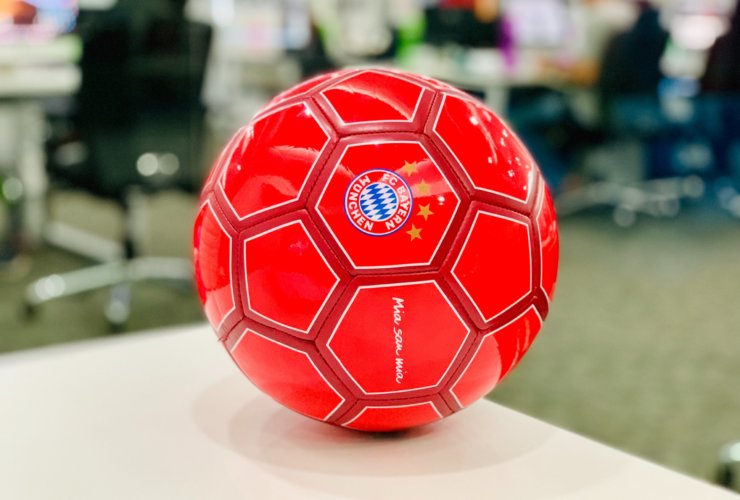 red soccer ball on white table
