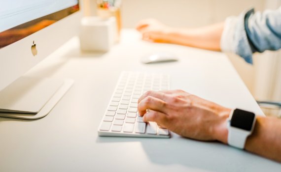 person using iMac