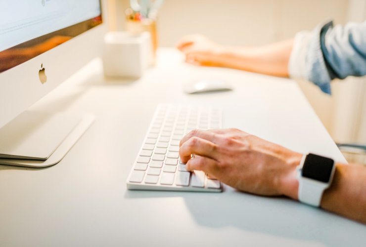 person using iMac