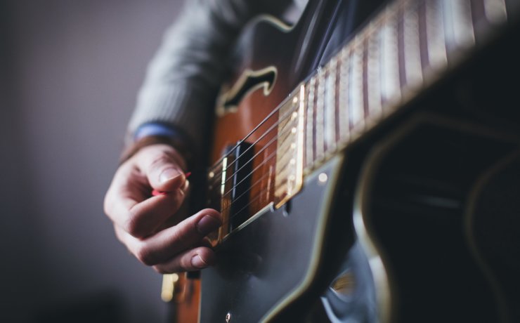 person playing guitar
