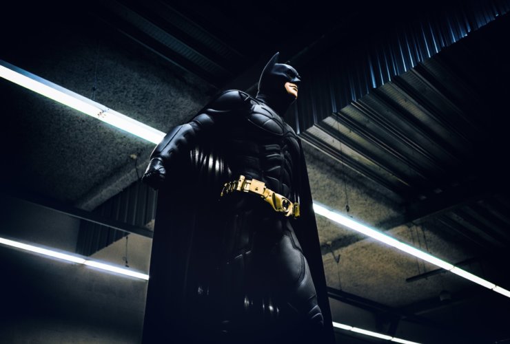 Batman standing under steel roof