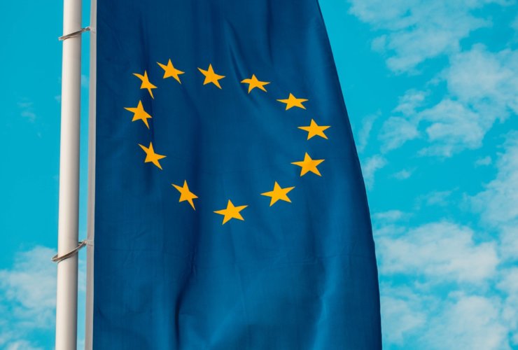 blue and yellow stars flag on pole
