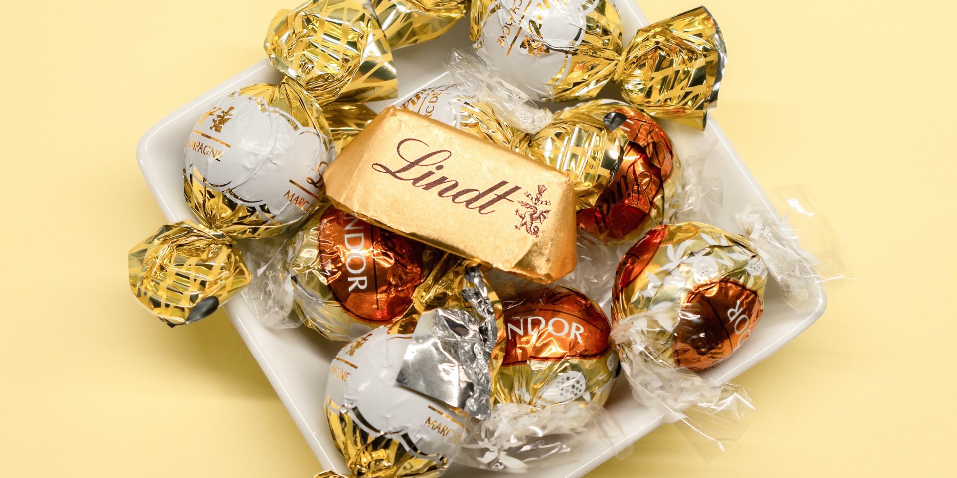 gold and silver round coins in clear plastic pack