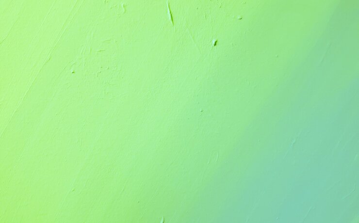 green painted wall with hole